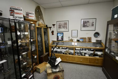a display of antique and historical items at the Athabasca Archives