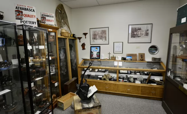 a display of antique and historical items at the Athabasca Archives